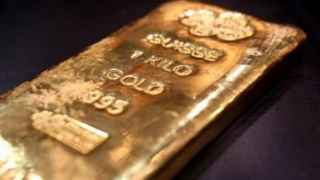 Đồng USD mạnh lên kìm đà tăng của giá vàng