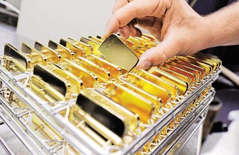 Vàng tăng do USD chịu áp lực từ chính sách tiền tệ của Mỹ