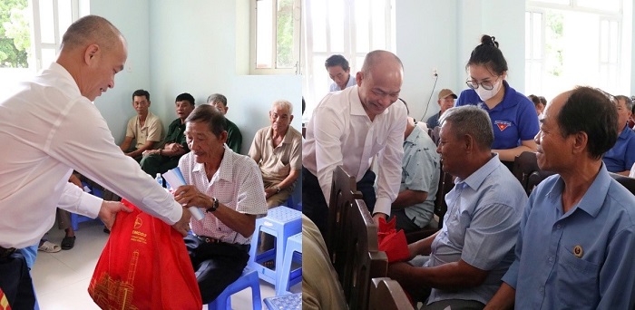 Ông Nguyễn Hữu Nam - Phó Giám đốc Công ty Nhiệt điện Vĩnh Tân trao quà cho gia đình chính sách của xã Vĩnh Hảo